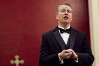 Tenor Jezz James singing at a wedding ceremony